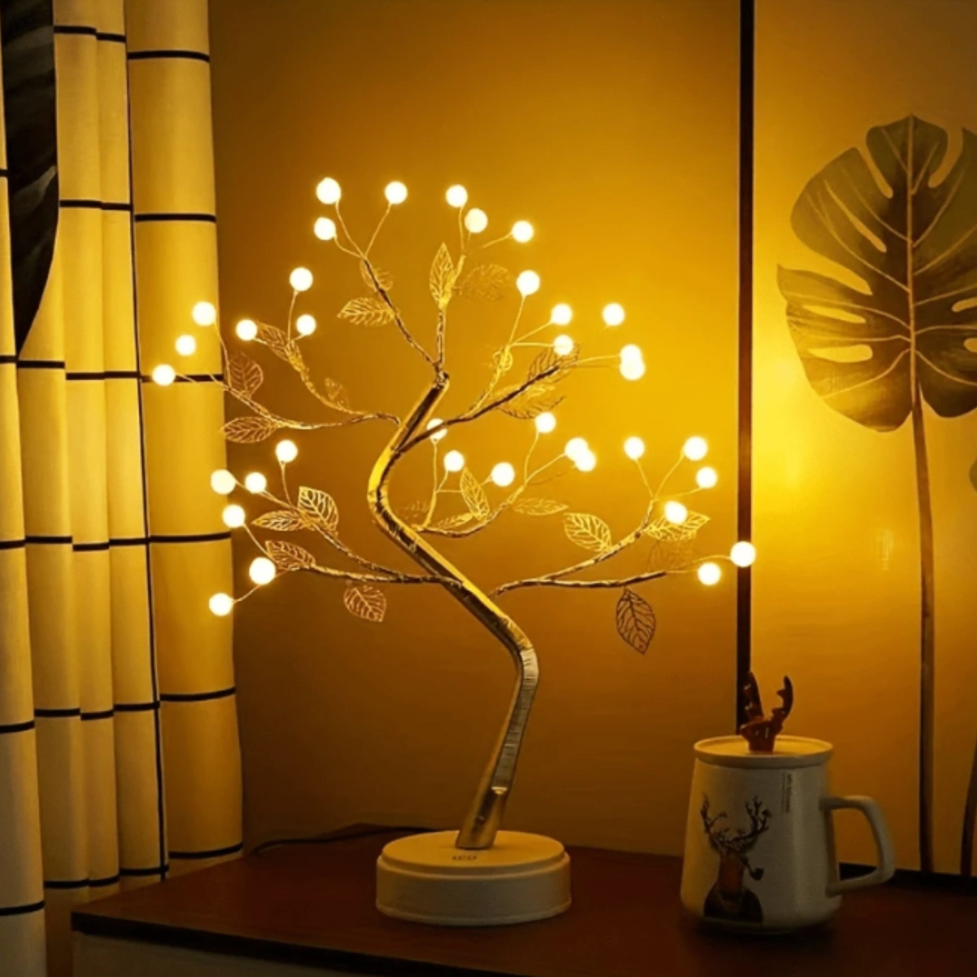 arbre lumineux led feuilles dorées sur une étagère